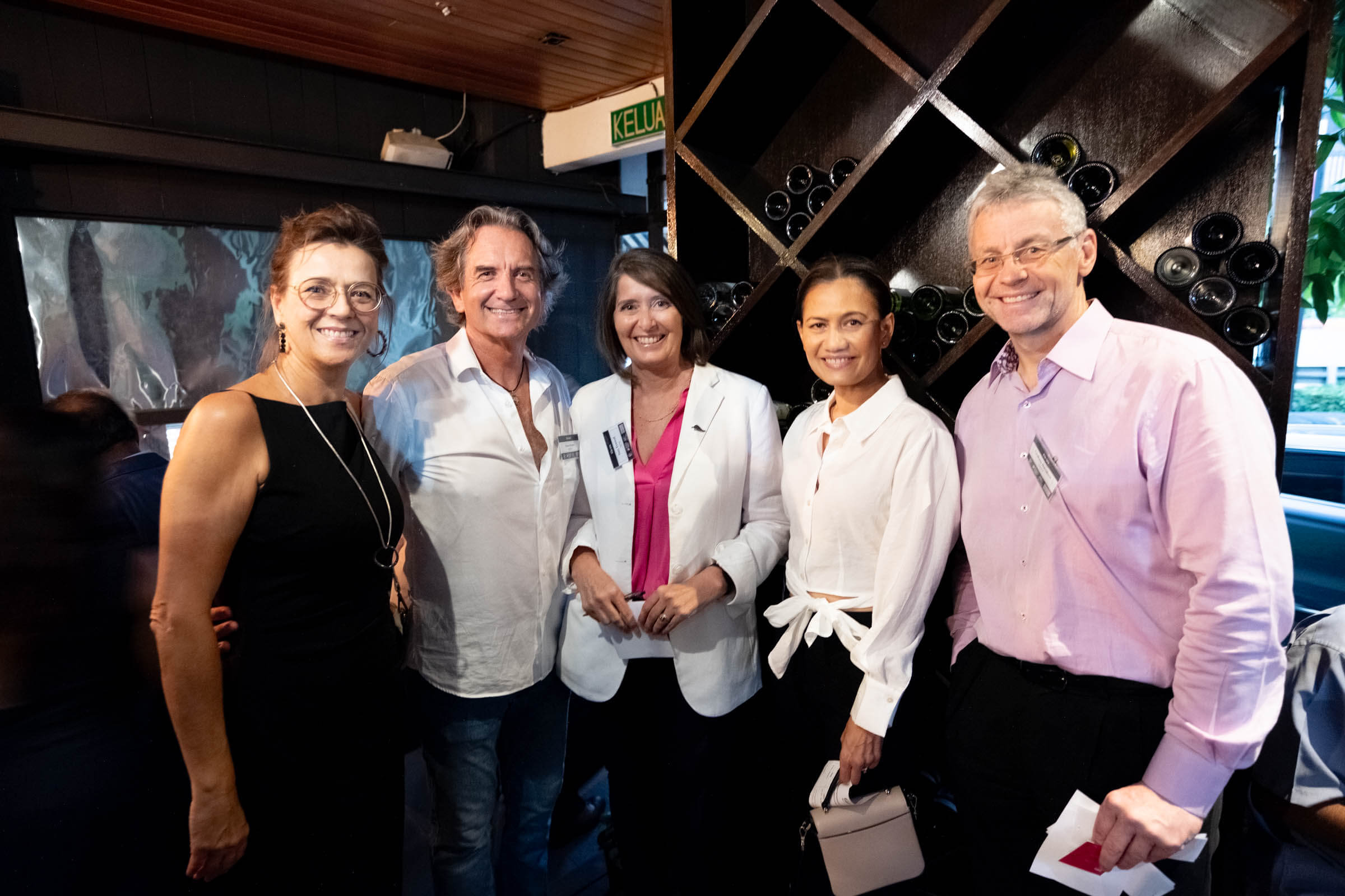 MNZCC members networking at an evening chamber event